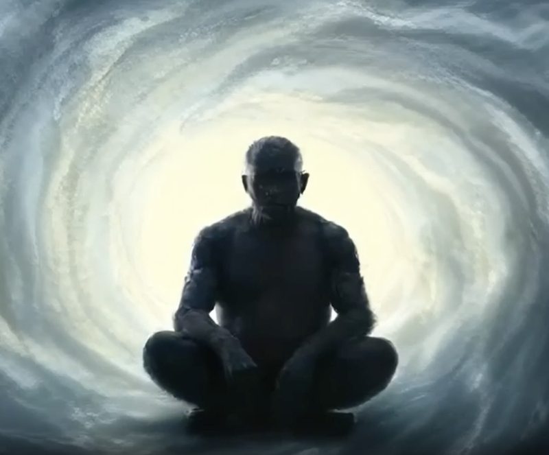 Figure sitting in stillness inside a spiral of light